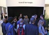 Sony booth-goers watch their 24.5-inch glasses-free OLED TV, which like all glasses-free prototypes is displayed in a darkened environment