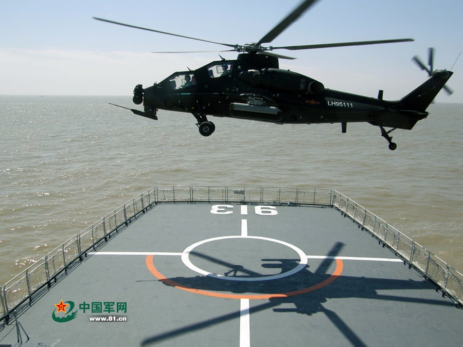 An Army Z-10 helicopter begins to land on a LST. The ability of the PLA to launch operations from navy warships can be used for both small counterterrorist missions and large scale amphibious warfare.