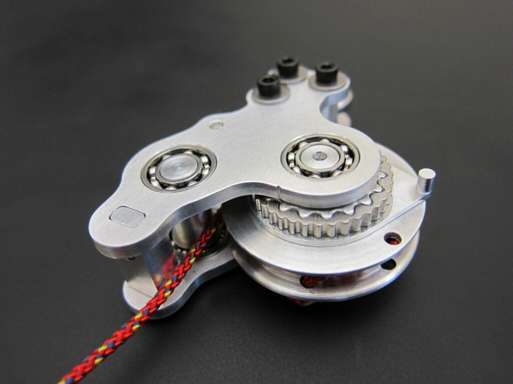 The unpowered exoskeleton clutch, which engages and disengages a spring in parallel with the user's Achilles tendon.