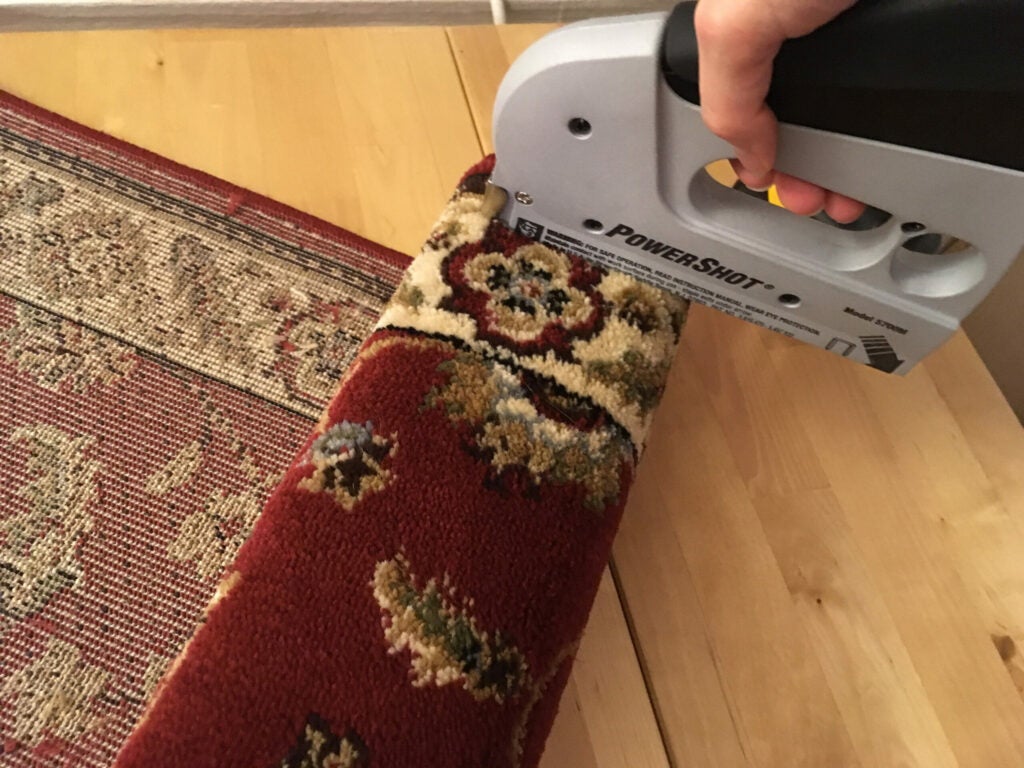 stapling carpet to post