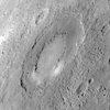 This unnamed impact basin was seen for the first time during <em>Messenger</em>'s third flyby of Mercury. The outer diameter of the basin is approximately 160 miles. This basin has a double-ring structure common to basins with diameters larger than 125 miles. The floor of the basin consists of a smooth plain. Concentric troughs, formed by surface extension, are visible on the basin floor. Such troughs are rare on Mercury, and the discovery of such features is of great interest to <em>Messenger</em>'s science team.