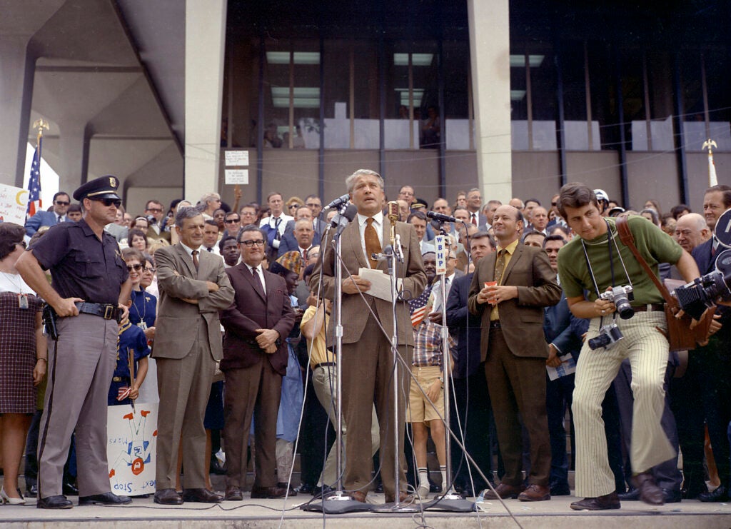 Von Braun addresses the local crown in Huntsville after Apollo 11's splashdown. Notice towards the left is what looks like a boy holding a sign upside down that reads "Next stop Mars."
