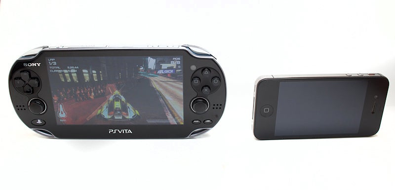 The PS Vita next to an Apple iPhone 4. The Vita is much bigger (that is a good observation).