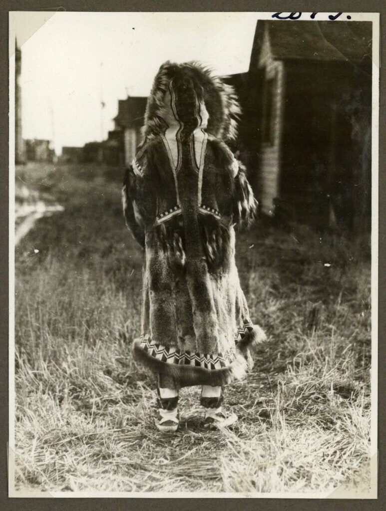 Inuit woman photographed from behind, circa 1921