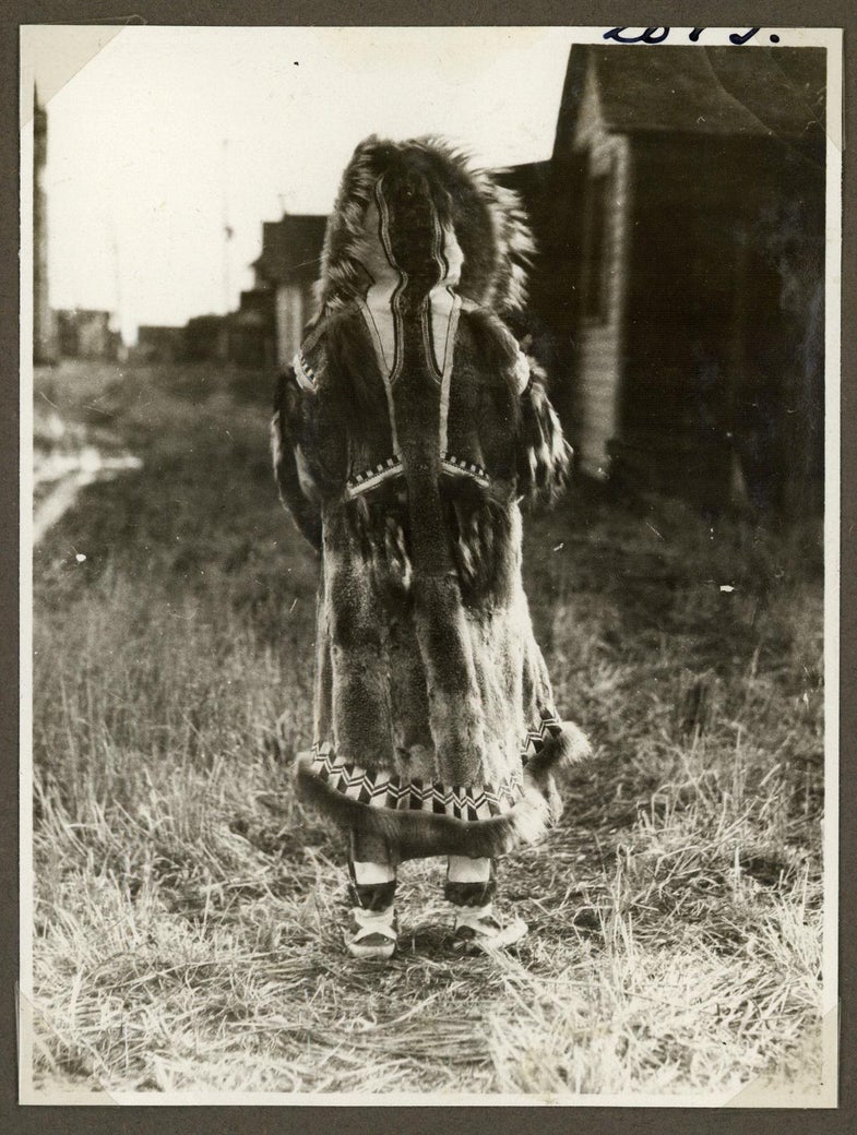 Inuit woman photographed from behind, circa 1921