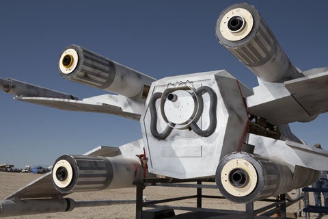 The back of a homemade Star Wars X-wing fighter rocket, showing its four thrusters.