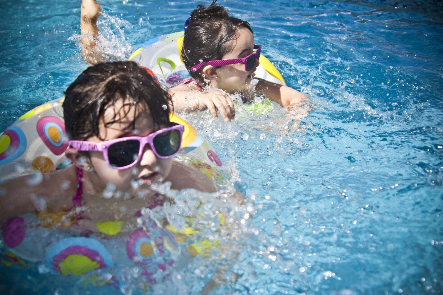 Swimming pools are full of poop, but they probably won’t make you sick