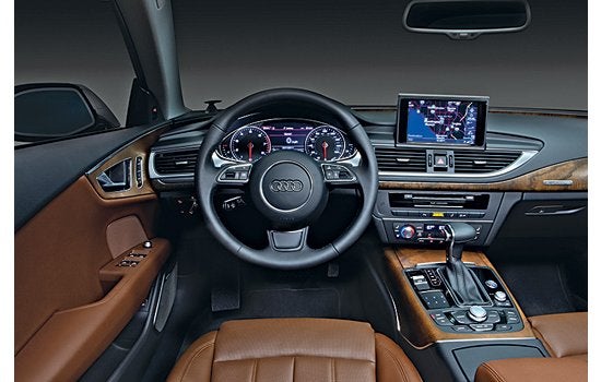 The Audi A7 is the world's first fully Web-connected car. A built-in cellular data connection allows drivers to pull high-resolution 3-D aerial images from Google Maps into the navigation screen, dispatching with current cartoonish maps. Using voice commands or controls on the center console, drivers can also search phone numbers, weather maps, real-time gas prices from nearby stations, or Google acoffee shopa to look for a spot in the neighborhood. For safety reasons, drivers can't pull up fantasy-football scores at a stoplightabut because the A7 generates a Wi-Fi signal, any passenger with a laptop can check them for you. <em>Jump to the beginning of the <a href="https://www.popsci.com/?image=0">Auto Tech</a> section.</em> <strong>Jump to another Best of What's New category:</strong>