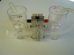 Two clear plastic cylinders connected together.