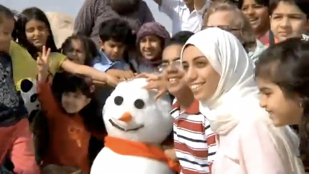 The snowman with Saleh al-Haddad, first from right, and his older sister Amna al-Haddad.