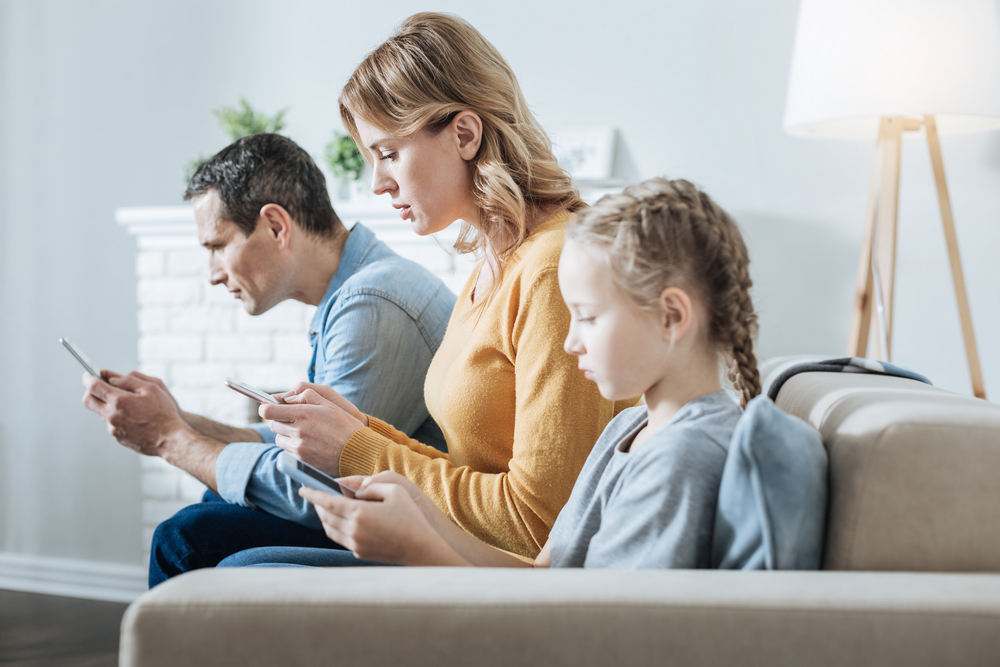 Teens’ screen addiction might be contagious, and parents are patient zero
