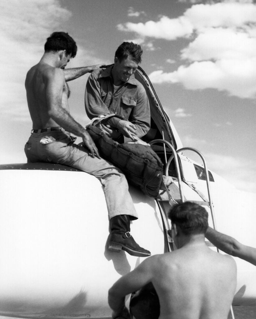 Another moment of crews taking advantage of the lax uniform rules in the desert in 1949, on the ramp with a D-558-I and Bob Champine in the cockpit.
