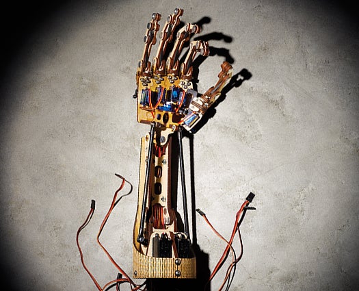 Six servomotors lend Roy the Robot's laser-cut wood hands a wide range of motion similar to that of human hands.