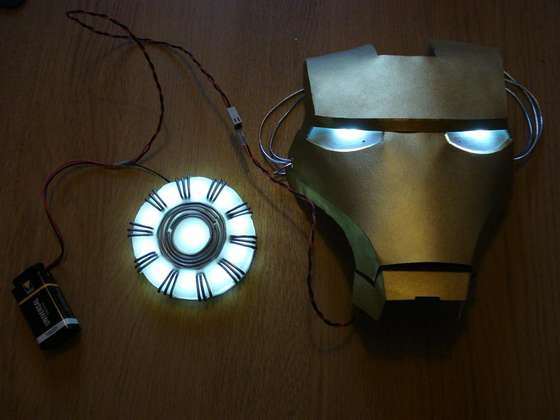 A glowing arc reactor and an Iron Man mask with light-up eyes.