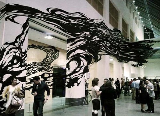 Artist Sun K. Kwak makes incredible 3-D painting-sculptures out of black masking tape, spontaneously tearing apart roll after roll to create wavy, smoke-like shapes on walls.