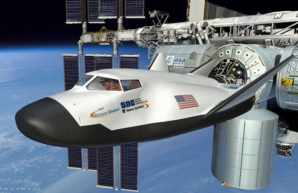 Illustration of Sierra Nevada's Dream Chaser spacecraft docked with the International Space Station.