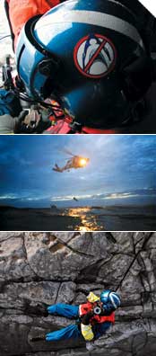 HANGING TIGHT<br />
(From top) No shark bait here; nighttime open water and cliff rescues are all in a day's work. A Coast Guard rescue swimmer from Air Station Sitka in Alaska dangles below an HH-60J Jayhawk helicopter while practicing a cliff rescue on Biorka Island.