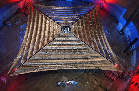 Testing a sail that turns sunlight into rocket fuel In a test chamber at NASA Glenn Research Center´s Plum Brook Station in Sandusky, Ohio, engineers show off a 20-by-20 meter solar sail that automatically unfurls when its four support tubes are inflated. Built by L'Garde, Inc., of Tustin, California, the sail is made of Mylar less than one tenth the thickness of a trash bag. It´s designed to deflect photons from sunlight to propel a spacecraft forward with little fuel. A larger version of the sail is a candidate for NASA's Space Technology 9, a mission for experimental technologies that could fly in the next five years.