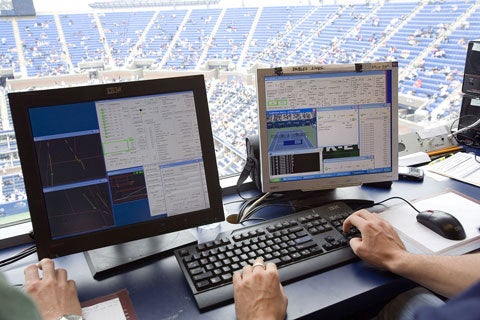 From the control room, one of Hawkins's technicians oversees the 10-camera data-crunching on the left screen while the ball's three-dimensional trajectory and landing point are shown on the right-hand screen.