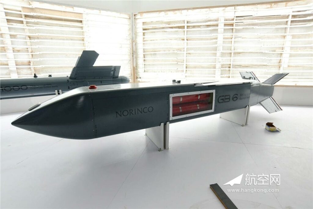 The NORINCO GB-6 is a stealthy glide bomb with a range of up to 130km. This mockup shows satellite communication and navigation antenna, as well as a cutaway where dummy submunition bomblets, either anti-runway, FAE or anti-armor, will be dispersed over the target.