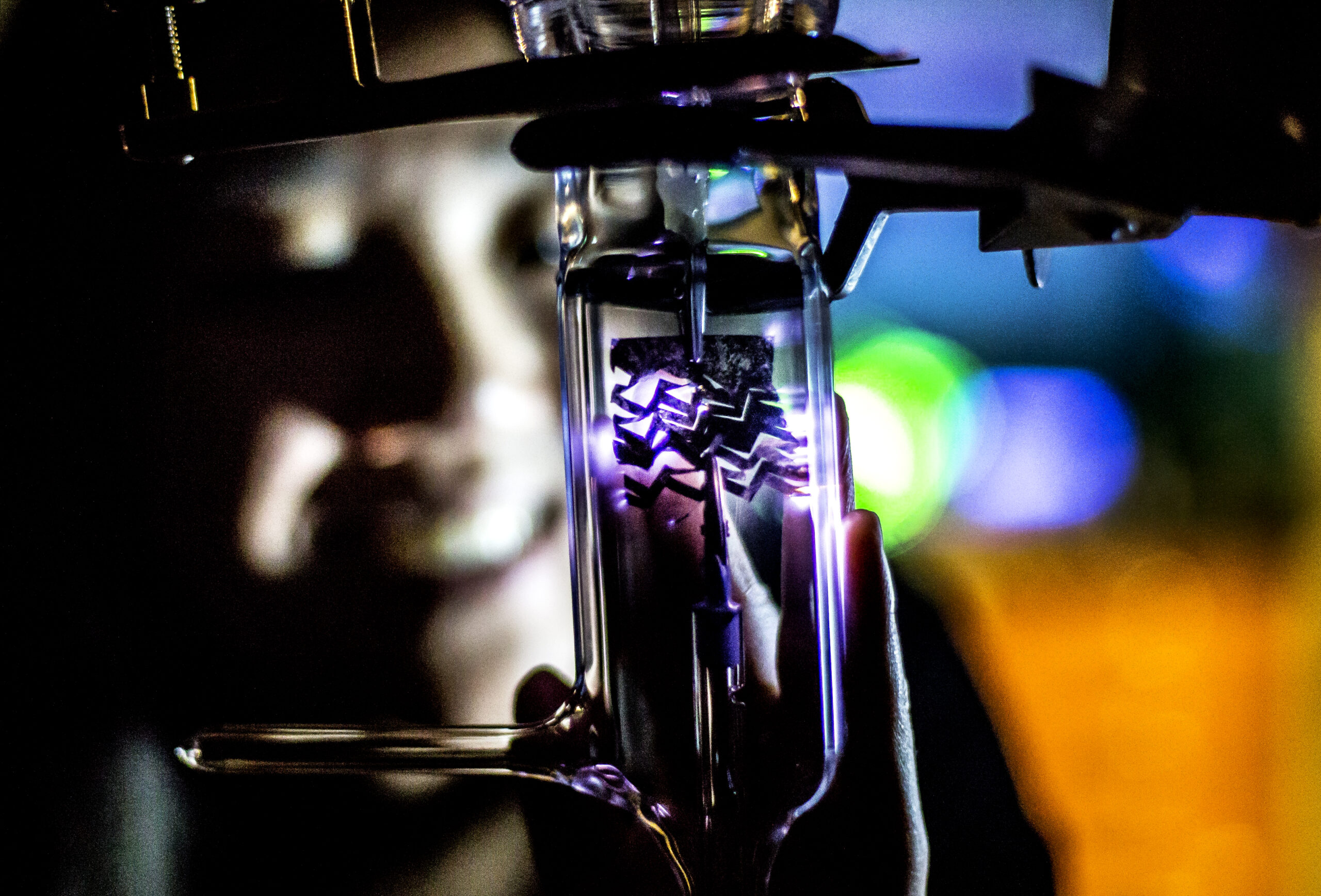 Terry Shyu, MSE PhD Student and Graduate Research Assistant, demonstrates a stretchable conductor's ability to conduct in the HH Dow Building on June 10, 2015. The stretchable conductor is made out of a mesh structure of carbon nanotubes that Shyu has made as part of her work with Nicholas Kotov, Joseph B. and Florence V. Cejka Professor of Chemical Engineering; Sharon Glotzer, Stuart W. Churchill Collegiate Professor of Chemical Engineering; and Matt Shlian, Artist and Adjunct Lecturer in the School of Art & Design. Shlian provided the inspiration for the nano structures with his nano-kirigami art that Glotzer built computer models from and Kotov and Shyu tested in lab. Photo: Joseph Xu, Michigan Engineering Communications and Marketing www.engin.umich.edu