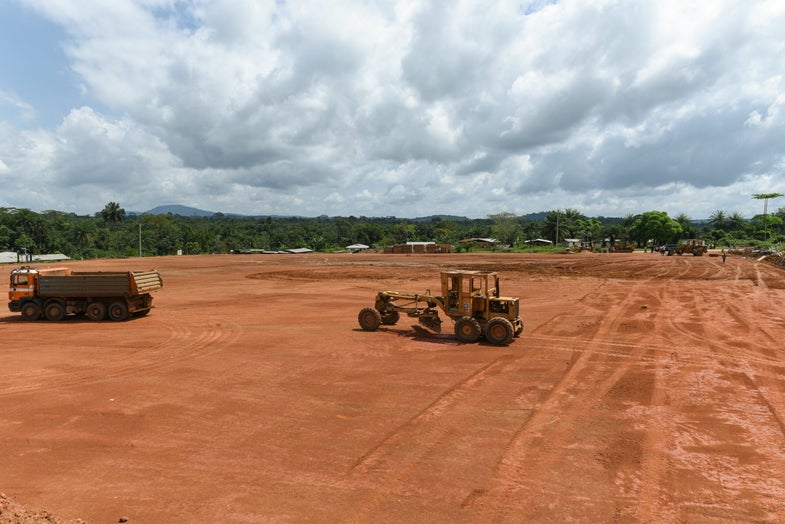 U.S. Army engineers and private construction contractors clear a large plot of jungle to build an Ebola treatment unit (ETU) in Tappita, a town in rural eastern Liberia.