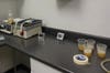 Typical day in the lab. On the right, samples of beer from the brewery. On the left, conical vials containing beer and isooctane are taped to the shake table.