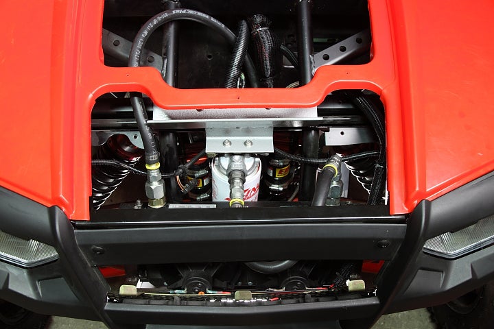 A hydro fluid cooler and hydro filter on a red ATV.