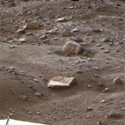 This image of the Martian terrain and two rocks named "Winkies" and "Quadlings" was taken on October 27, 2008. It was one of the last images taken before the Lander's final communication was received on November 2.