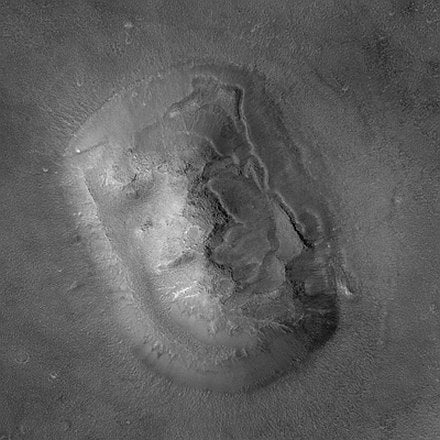 In 2001, the Mars Orbiter Camera acquired this high-resolution image of the same formation in Cydonia, which showed the "face" to actually be a highly eroded mesa that looks like a human face at certain times, due to shadows and lighting.
