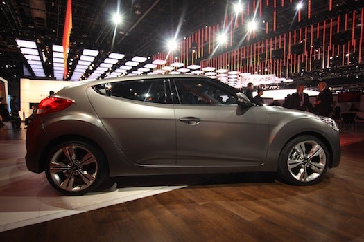 Hyundai's Veloster is, like the press conference at which it was revealed, a heavy-handed attempt to become hip with the cool kids. And it is very much a youthmobile, with a starting price of around $17,000, a 1.6-liter direct-injection engine, a paddle-shifted dual-clutch transmission, and three doors.