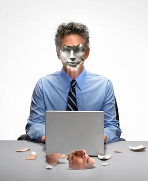 Man at the computer with a mask face