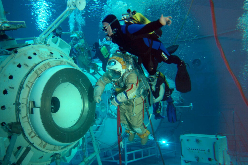 Astronaut Peggy A. Whitson (background), Expedition 16 commander, and cosmonaut Yuri I. Malenchenko, flight engineer representing Russia's Federal Space Agency, participate in an underwater spacewalk simulation in the Hydrolab facility at the Gagarin Cosmonaut Training Center, Star City, Russia. Whitson and Malenchenko are attired in training versions of Russian Orlan spacesuits. 