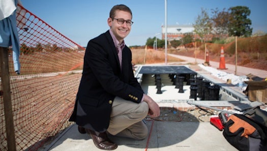 George Washington University land use planner Eric Selbst posed by the university's solar sidewalk while it was under construction.