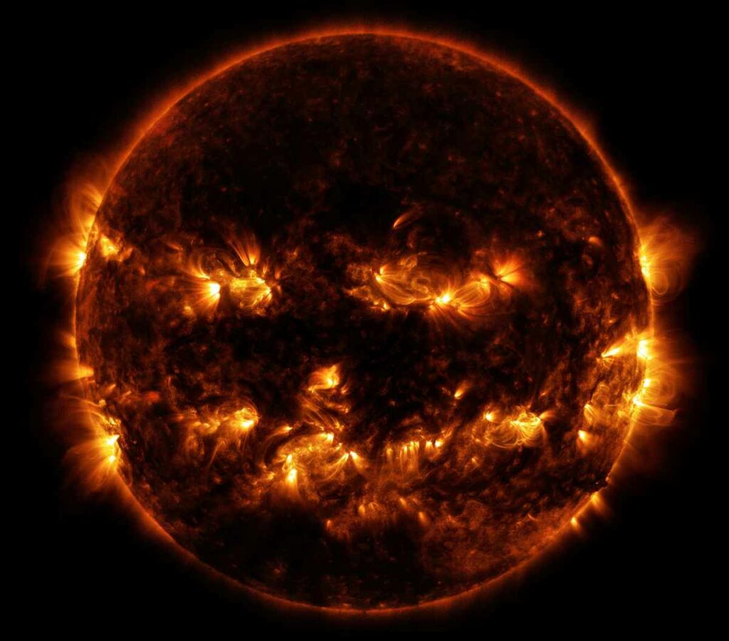 NASA released this October-appropriate image of the sun last week, showing active regions that mimic a Jack-O'-Lantern's toothy grin. It's just a coincidence, but it's nice to see old Sol getting in on the Halloween action. <a href="https://www.popsci.com/article/science/apocalypse-coins-biocakes-and-other-amazing-images-week/"><em>From October 17, 2014</em></a>