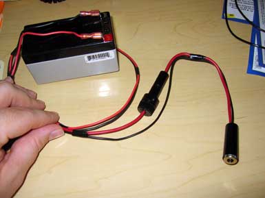 A pocket generator with wires connected to it.