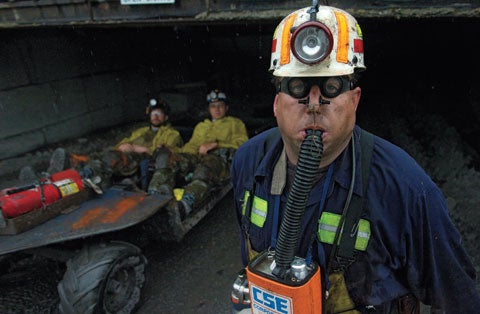 In a disastrous year, the mining industry looks more closely at its survival gear This picture was taken outside Pennsylvania´s Twin Rocks coal mine last spring. But it could easily have been taken 25 years ago, mining technology has evolved so little since then. Miner Joe Tenerowicz is demonstrating a self-rescuer, a chemical-based oxygen-production system that provides an hour of backup air. The device, which has been the standard emergency breather for a quarter century, was the only technology available to coal workers in West Virginia´s Sago Mine tragedy, which left 13 dead last January. This year has proved particularly fatal for U.S. miners; to date, 37 have died in 21 incidents, a 30 percent higher rate than in recent years. For the industry, it´s been a wake-up call. Under the federal Miner Act, which went into effect in June, better devices-including replacement cartridges that increase the breathing time of existing self-rescuers and new â€hybridâ€ units that rely on filters to deal with poor air quality-will be developed in the next two years.