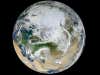 We love "blue marble" pics. This one's more of a white marble, though, seeing as it was taken with the arctic circle on top. Read more <a href="http://www.nasa.gov/multimedia/imagegallery/iotd.html">here</a>.