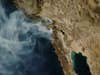 The 2007 California wildfires, as viewed from space. Fires burned from Santa Barbara to the U.S.-Mexico border.