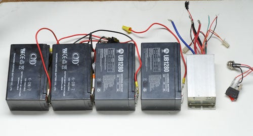 Four batteries and a motor, all connected by wires.