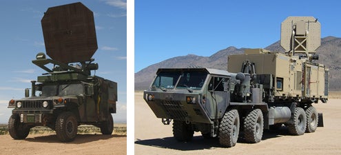 two military trucks with with heat rays on top