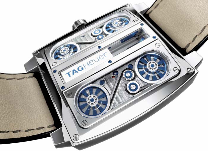 <em>Three panels of synthetic sapphire provide a peek under the hood of this chronometer.</em>