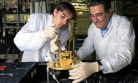 Haroche, right, and his assistant Igor Dotsenko are setting up a cavity experiment in this image from the French National Center for Scientific Research.