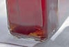 Red maple vinegar in a rectangular glass bottle.