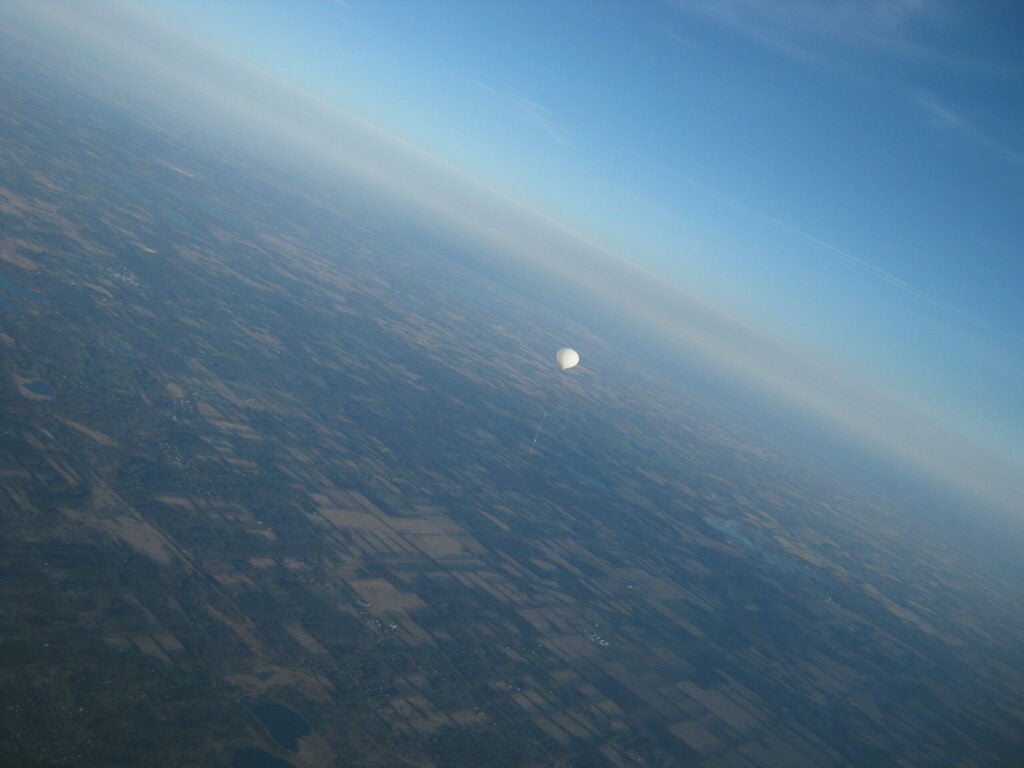photo of a high-altitude balloon rising over farms in central Michigan