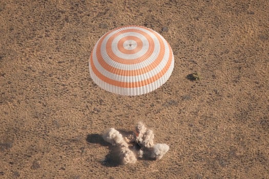And here's the moment of landing. The spacecraft carried on board three astronauts: Ron Garan (an American who may be most familiar to readers for his <a href="http://www.popphoto.com/news/2011/08/astronaut-captures-photo-meteor-above/">prolific photography</a>) and Russians Andrei Borisenko (the Commander of the mission) and Alexander Samokutyayev.