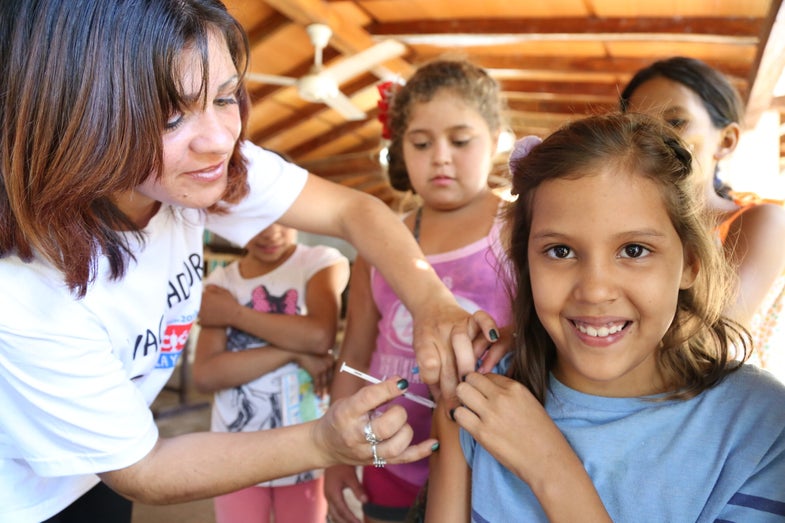 girl getting rubella and measles vaccine in Paraguay