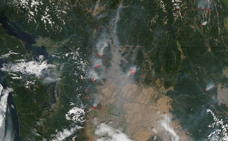 This image, taken by equipment on NASA's Aqua satellite on the evening of August 11, 2014, shows a dozen wildfires burning across the state of Washington (as well as a couple in Montana to the far right).