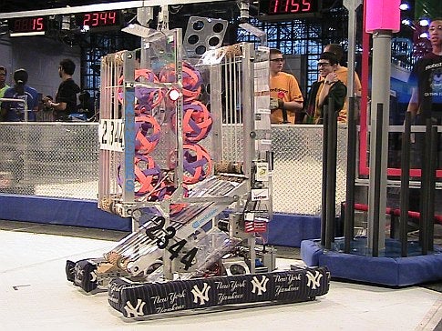 A homemade robot in an arena in front of a crowd at the 2009 FIRST Robotics Competition in New York City.