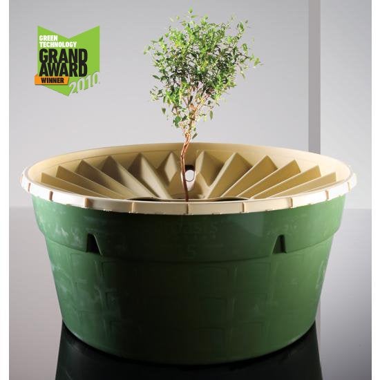 <em>The Groasis Waterboxx is our 2010 Best of What's New Innovation of the Year.</em> Deforestation and overfarming have helped decrease the productivity of about 70 percent of the world's arid and semi-arid lands, which could force the migration of 50 million people by 2017. Our innovation of the year, the Groasis Waterboxx, an irrigation-free plant incubator, could help make these lands fertile again. And it's nothing more than an exceptionally well-designed bucket. Drylands actually have enough water to sustain trees for decades, but it's several feet beneath the surface. Because rain and irrigation evaporate quickly, many young plants die before their roots can tap that reservoir. The Waterboxx, shaped more like a doughnut than a box, helps plants survive long enough to make it through that layer of dry soil. Place the tub around a freshly planted seedling, and fill the evaporation-proof basinajust onceawith four gallons of water. The Waterboxx does the rest. At night, its top cools faster than the air, collecting condensation to supplement those initial gallons. The tub drips about three tablespoons of water a day into the soil, sustaining the plant while encouraging its roots to grow deeper in search of more water. Once the plant reaches the moist soil layer, usually after a year, the farmer lifts the box off the plant and reuses it on the next sapling. Each Waterboxx is expected to last 10 years, and, for about a buck or two per tree grown, is cheap enough to use in poor nations. In tests in the Sahara, 88 percent of Waterboxx-sheltered trees survived, versus 10 percent of trees with traditional cultivation. But the mighty tub's inventor, Pieter Hoff, still isn't satisfied. He's working on a biodegradable version that decomposes to feed the plant too. $275/10 boxes; <a href="http://www.groasis.com/">groasis.com</a> See more at the Best of What's New 2010 site. <strong>Jump To:</strong>